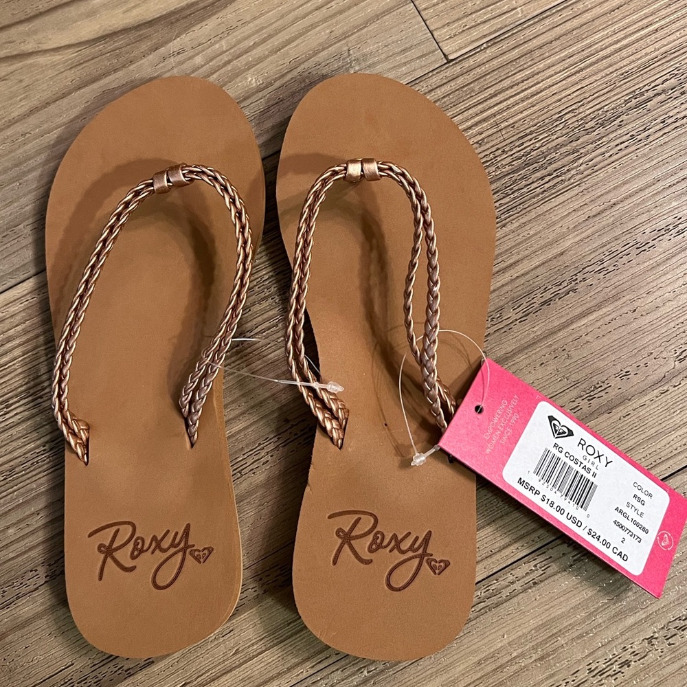 Roxy rose gold flip flops